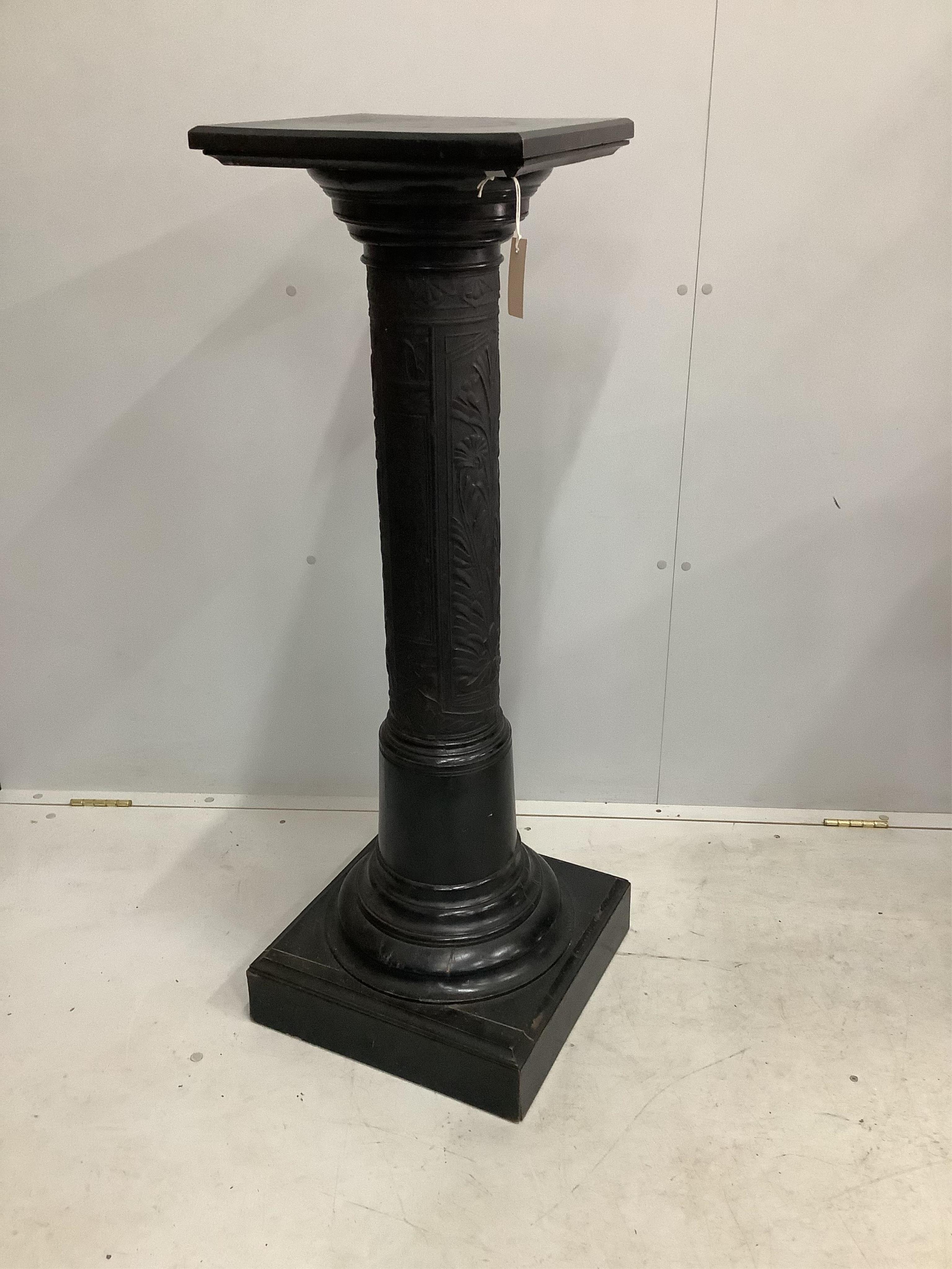 A late Victorian carved and ebonised pedestal, width 36cm, height 115cm. Condition - fair